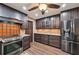 Well-equipped kitchen with stainless steel appliances and dark wood cabinetry at 1509 Shadow Ridge Cir, Sarasota, FL 34240