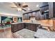 Gourmet kitchen featuring dark cabinetry, granite countertops, and stainless appliances at 1509 Shadow Ridge Cir, Sarasota, FL 34240