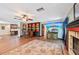 Inviting living room featuring a stylish bar area, fireplace, and wood floors at 1509 Shadow Ridge Cir, Sarasota, FL 34240
