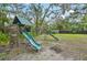 Backyard playground with swings, slides, and climbing features for hours of outdoor fun at 1509 Shadow Ridge Cir, Sarasota, FL 34240