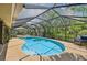 Inviting screened pool with ample deck space for relaxing and entertaining in this backyard oasis at 1509 Shadow Ridge Cir, Sarasota, FL 34240