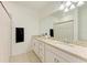 Bathroom with a large mirror, granite countertops, and ample cabinet space at 15164 Sunny Day Dr, Bradenton, FL 34211