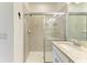 Contemporary bathroom featuring tiled shower with glass enclosure and updated fixtures at 15164 Sunny Day Dr, Bradenton, FL 34211