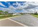Entrance to Lorraine Lakes with landscaped median and paver streets at 15164 Sunny Day Dr, Bradenton, FL 34211