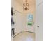 Bright entryway with tile floors, closet space and a stylish light fixture at 15164 Sunny Day Dr, Bradenton, FL 34211