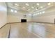 Spacious indoor basketball court with light wood flooring, high ceilings, and ample natural light at 15164 Sunny Day Dr, Bradenton, FL 34211