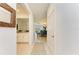 Bright hallway with tile floors leading to an open dining and living area at 15164 Sunny Day Dr, Bradenton, FL 34211