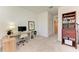 Bright office featuring a modern desk, comfortable chair, and ample storage space at 15164 Sunny Day Dr, Bradenton, FL 34211