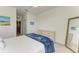 Bright bedroom featuring neutral carpet, ceiling fan and large mirror at 15225 Lyla Ter, Bradenton, FL 34211