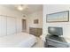 Bright, carpeted bedroom featuring a ceiling fan, art, and desk at 15225 Lyla Ter, Bradenton, FL 34211