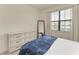 Bright bedroom featuring a dresser and a window for ample natural light at 15225 Lyla Ter, Bradenton, FL 34211