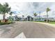 Stunning clubhouse featuring manicured landscaping, multiple palm trees, and a welcoming entrance at 15225 Lyla Ter, Bradenton, FL 34211