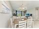 Inviting dining area adjacent to the living room, featuring stylish decor and ample natural light at 15225 Lyla Ter, Bradenton, FL 34211