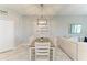 Bright dining area with modern lighting, a wooden table, and comfortable seating for six at 15225 Lyla Ter, Bradenton, FL 34211