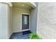 Inviting front entrance featuring a modern door with glass, complemented by stylish stone pavers and verdant greenery at 15225 Lyla Ter, Bradenton, FL 34211