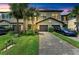 Inviting townhome with a well-manicured lawn and a paved driveway, nestled in a vibrant community with lush landscaping at 15225 Lyla Ter, Bradenton, FL 34211