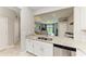 Open-concept kitchen featuring granite countertops, stainless steel appliances, and a view of the living room at 15225 Lyla Ter, Bradenton, FL 34211