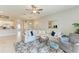 Spacious living room features ample seating, modern decor, and seamless flow to other living areas at 15225 Lyla Ter, Bradenton, FL 34211