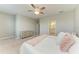 Bright main bedroom with a ceiling fan and an ensuite bathroom at 15225 Lyla Ter, Bradenton, FL 34211