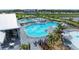 Aerial view of a resort-style community pool with ample seating, umbrellas, and lush landscaping at 15225 Lyla Ter, Bradenton, FL 34211