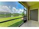 Relax on the screened lanai with serene views of the pond and lush green landscape at 15225 Lyla Ter, Bradenton, FL 34211