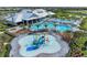 Aerial view of water park featuring slides and sprinklers near community pool and clubhouse at 15225 Lyla Ter, Bradenton, FL 34211