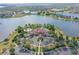 Breathtaking aerial view of the clubhouse, pool, lake, and parking area at 15315 Anchorage Pl, Lakewood Ranch, FL 34202