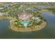 Aerial view of a community clubhouse, pools, and lake at 15315 Anchorage Pl, Lakewood Ranch, FL 34202