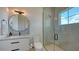Modern bathroom featuring glass enclosed shower, sleek vanity, and ample natural light at 15315 Anchorage Pl, Lakewood Ranch, FL 34202