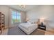 Bright bedroom with large windows, neutral decor, and stylish black and white striped rug at 15315 Anchorage Pl, Lakewood Ranch, FL 34202