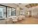 A dining room with a view to the living room, kitchen and with hardwood flooring at 15315 Anchorage Pl, Lakewood Ranch, FL 34202