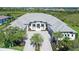 Elegant home exterior featuring a grand facade, well-manicured landscaping, and a spacious paver driveway at 15315 Anchorage Pl, Lakewood Ranch, FL 34202