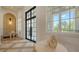 Beautiful foyer with modern lighting and a grand front door, complemented by neutral decor at 15315 Anchorage Pl, Lakewood Ranch, FL 34202
