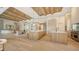 A spacious living room and kitchen with hardwood floors and pendant lighting at 15315 Anchorage Pl, Lakewood Ranch, FL 34202