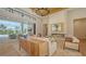 Modern living room with a fireplace, an open floor plan, and seamless access to the outdoor living area and pool at 15315 Anchorage Pl, Lakewood Ranch, FL 34202