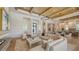 Open-concept living room featuring a fireplace, stylish furnishings, and elegant light fixtures at 15315 Anchorage Pl, Lakewood Ranch, FL 34202