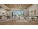 Bright and airy living room with high ceilings, modern furnishings, and a seamless indoor-outdoor flow at 15315 Anchorage Pl, Lakewood Ranch, FL 34202