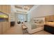 A light-filled main bedroom features a tray ceiling and an elegant seating area at 15315 Anchorage Pl, Lakewood Ranch, FL 34202
