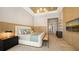 A main bedroom featuring a king-size bed, and an elegant seating area at 15315 Anchorage Pl, Lakewood Ranch, FL 34202