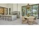 Outdoor kitchen and dining area providing seamless indoor-outdoor living with access to the pool at 15315 Anchorage Pl, Lakewood Ranch, FL 34202