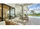 Inviting outdoor seating area with seamless transition to the pool and indoor kitchen at 15315 Anchorage Pl, Lakewood Ranch, FL 34202