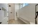 Modern shower showcasing beautiful stone bench seating and multiple shower heads at 15315 Anchorage Pl, Lakewood Ranch, FL 34202