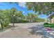 Street view of a gated community entrance with lush landscaping at 15315 Anchorage Pl, Lakewood Ranch, FL 34202