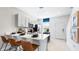 Stylish kitchen with stainless appliances, white cabinets, a breakfast bar, and a practical layout at 16538 San Nicola Pl, Bradenton, FL 34211