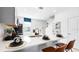 Bright kitchen boasts a white quartz countertop island and modern stainless steel appliances at 16538 San Nicola Pl, Bradenton, FL 34211