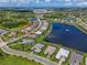 An aerial view of the real estate property and neighborhood highlighting nearby lakes and golf courses in the background at 17110 Verona Pl, Bradenton, FL 34202
