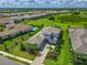 Beautiful home featuring professional landscaping, long driveway, and a view of the surrounding area at 17110 Verona Pl, Bradenton, FL 34202