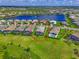An aerial view highlighting the real estate property and surrounding homes, some with screened in pools at 17110 Verona Pl, Bradenton, FL 34202