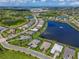 An aerial view of the neighborhood highlighting many houses and surrounding lakes and golf course at 17110 Verona Pl, Bradenton, FL 34202