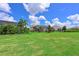 Wide shot of a well-maintained backyard with lush landscaping, offering a serene outdoor retreat at 17110 Verona Pl, Bradenton, FL 34202